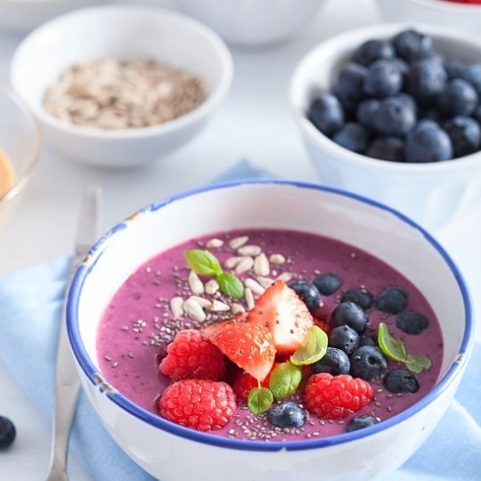 berry smoothie bowl with strawberry blueberry raspberry and chia seed
