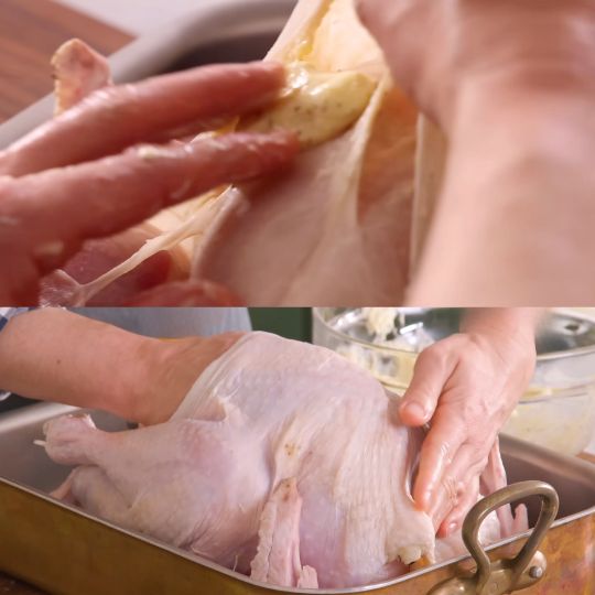 applying butter under skin of the turkey
